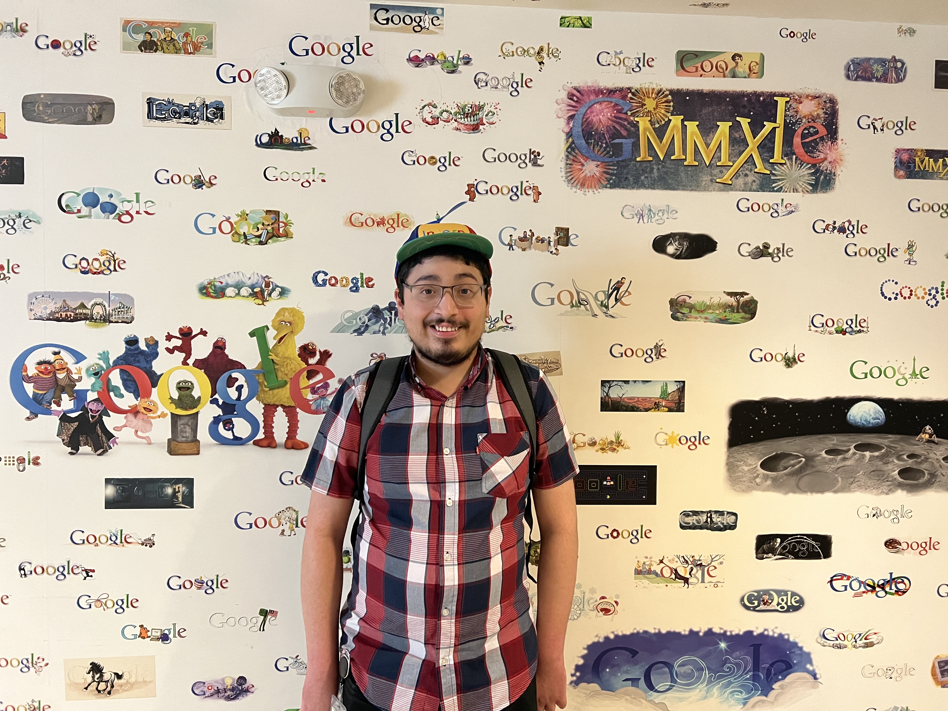 Giovanni Rivera standing in front of a Google-branded wall